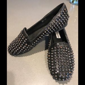 Studly in black Steve Madden loafers